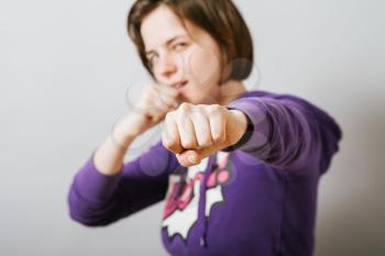 a girl ready for a fight with fists