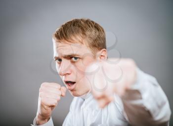 Angry man throwing a punch