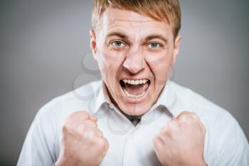Excited corporate guy clenching his fists