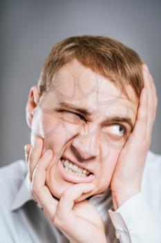 Stressed businessman crazy face expression, isolated