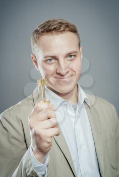 Man offering key to Your dream ...