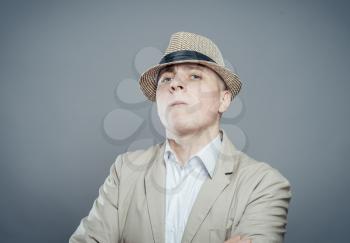 portrait of astonished businessman in hat