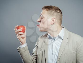 hungry man eating a fresh apple. 