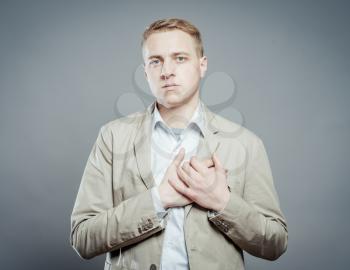 Both man's hands on breast because of hard breathing