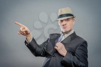 business man in hat pointing up finger isolated 