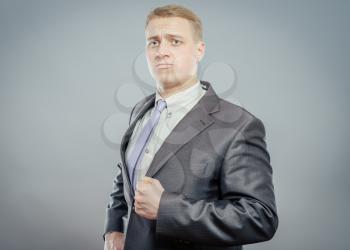 Young businessman is swearing allegiance 