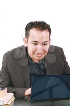 Businessman with amazed expression using a laptop 
