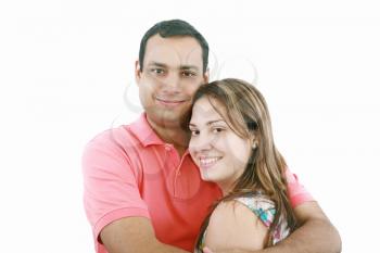 Portrait of a beautiful young happy smiling couple - isolated 
