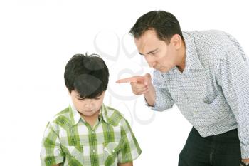 A father is threatening his little boy with a finger 
