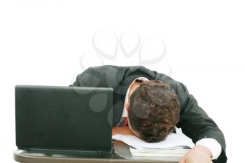 A portrait of a tired businessman resting his head on books over white background 