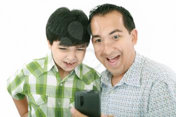 Young father and son was surprised, having read on mobile phone sms.
