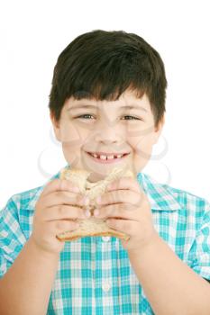Little boy eating a integral bread, sandwich. isolated on a white background 