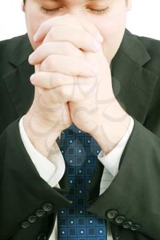 portrait of businessman praying for success 
