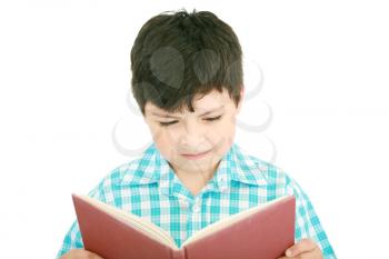 Small boy reading a book on a white background 
