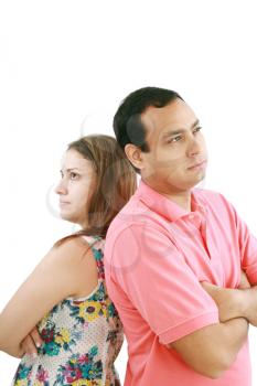 Young couple standing back to back having relationship difficulties on white background 
