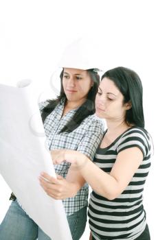 Attractive young engineer with helmet studying planes with her customer
