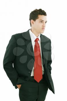 Young businessman over white background. Isolated fresh teenager in suit.