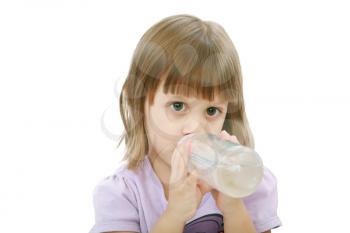 Little girl drinking water of her bottle. White background 
