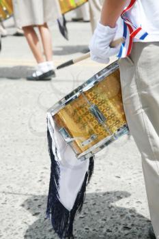 Drummer playing snare drums in parade, copy space, vertical 