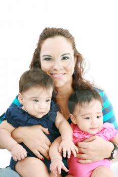 Happy young mother with two babies on a white background.