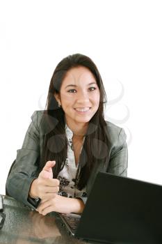 business woman sitting on chair at desk in office and pointing to you:yes,you! 

