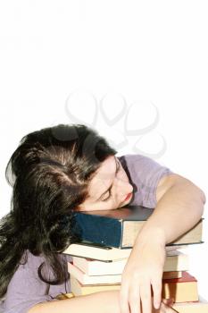 Young beautiful woman sleeping with books in a white background
