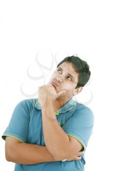 Thinking man isolated on white background. Closeup portrait of a casual young pensive businessman looking up at copyspace