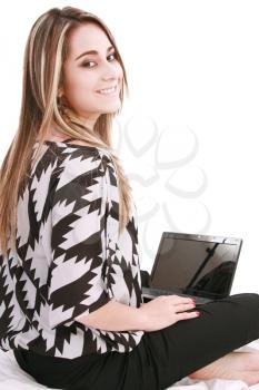 Portrait of beautiful woman using laptop while looking at you 