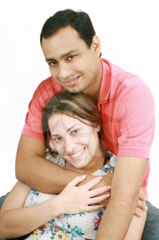 Young happy couple on white background 
