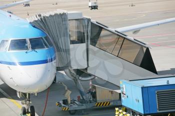 Airplane at an airport with passenger gangway 