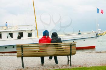 Couple watching boat on the winter