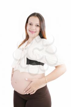 Pregnant happy woman hold her belly with hands looking at camera 

