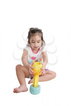 Funny little kid playing with toys, isolated over white 