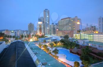 Panama close cityscape Top view with blue pool sorrounded by buildings in the sunrise