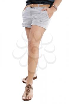 Woman legs with hot pants on white background 