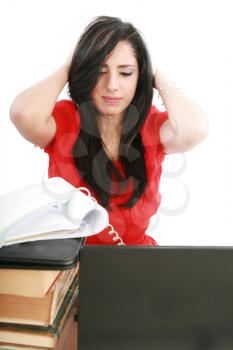 Young tired business woman with headache sitting at computer in workplace holding head 