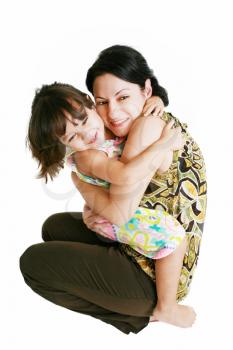Closeup portrait of mother and daughter in white studio