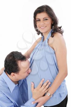 Father kissing pregnant belly of wife. Concept of love, over white background. 
