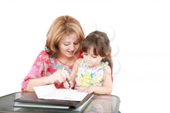 Mother and daughter doing homework at home 
