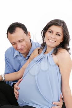 pregnant woman couple together smiling 
