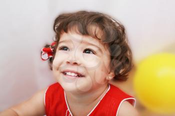 Two years old girl expressing happy over white background 