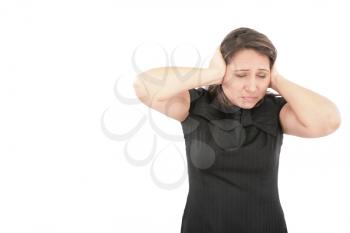 Stressed young woman covering his ears, grimacing and gesturing stop the noise 