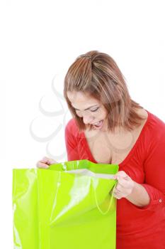 surprised brunette woman holding opened shopping bag 