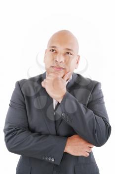 Portrait of handsome young thoughtful businessman isolated over white background