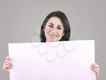 Beautiful woman with a banner smiling