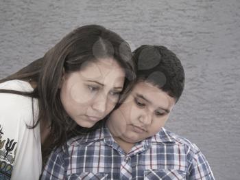 mother and son with sad expression 
