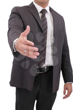 Business man with hand extended to handshake - isolated over white 