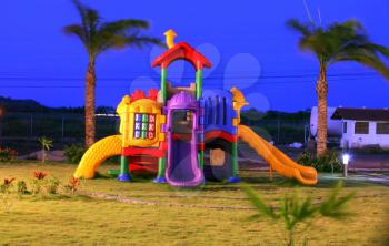 Colorful playground for childrens in the sunset.  Focus on the X and 0 game.