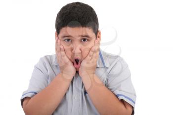 Scared litle kid boy holding hands on face and screaming isolated on white background 