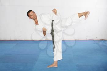 man practicing martial arts at the gym